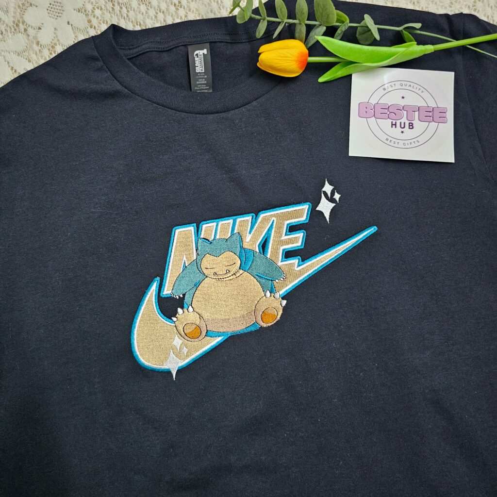 While printed anime tees have been popular for decades, the embroidered version offers an undeniable upgrade.