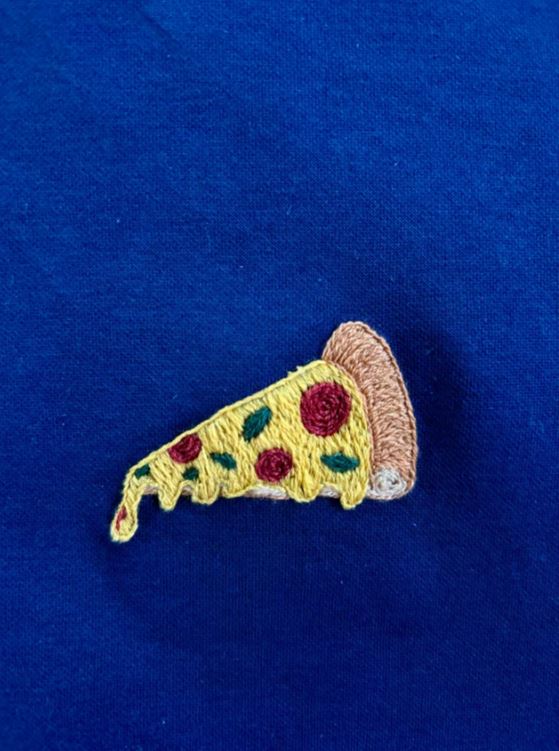 Hand embroiderer can bring your personal vision to life with details that matter only to you - even if it's a slice of pizza.