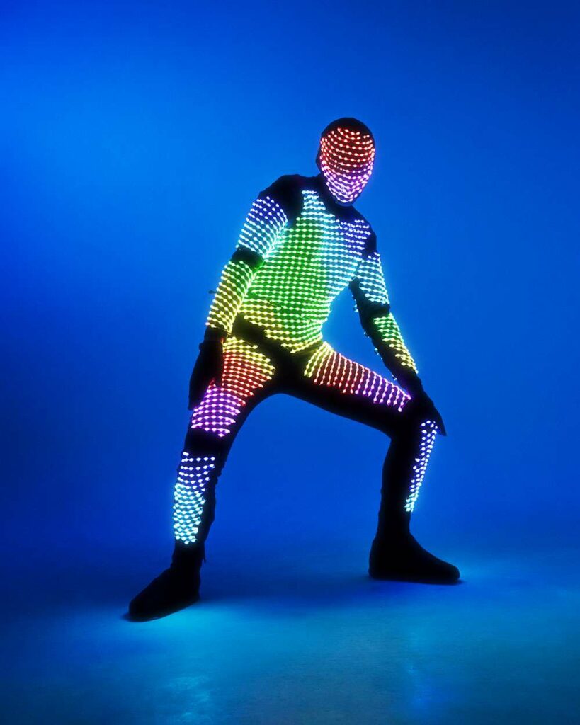 dance costume glows in the dark (1) It's like the line between human and machine is blurred.