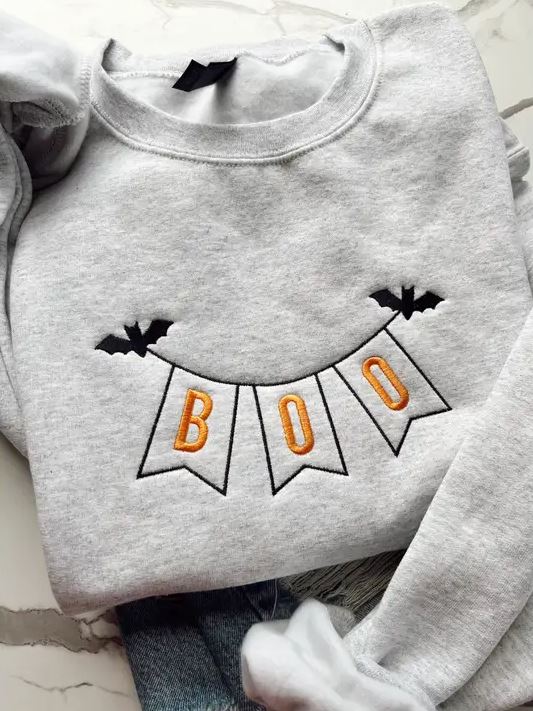 yifd Embroidered Halloween sweatshirt not only fits the vibe but also keeps you warm.